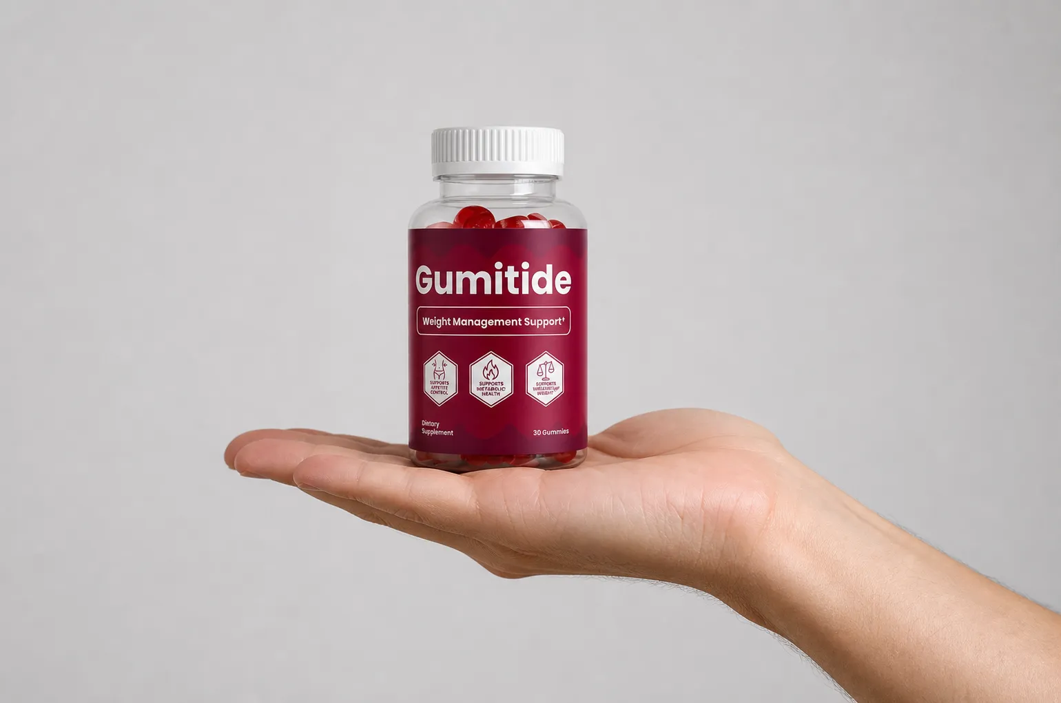 Gumitide — Verpackung in der Hand